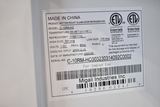Brand new Migali C-10RM-HC commercial cooler, 2023 model, 115V, single door, on casters. Label details temperature and refrigerant.