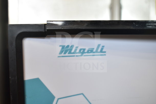 Migali C-10RM-HC logo on commercial single door reach-in cooler. Brand new, minor scratches, on commercial casters.