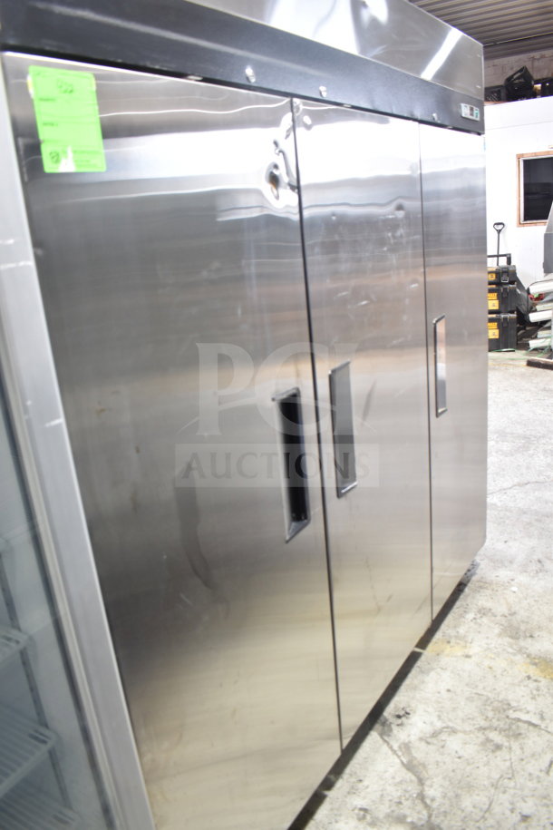 Migali C-3R-HC commercial 3-door reach-in cooler, stainless steel with minor scratches and dents, on casters, 115V.