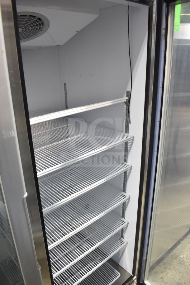 Brand new Migali G-2RG-A 2-door cooler, scratch and dent, on casters. Features adjustable shelves, 115V, 1 Phase.