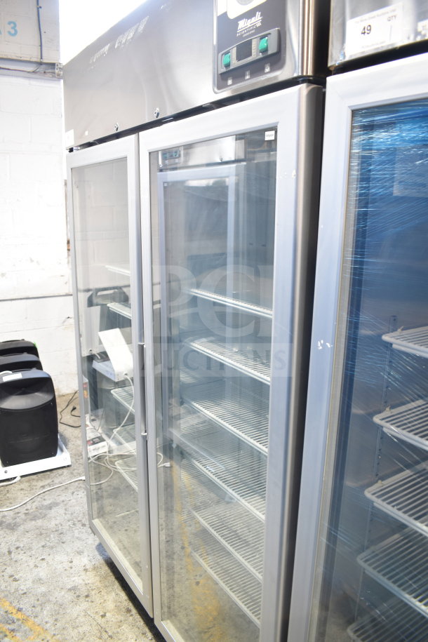 Brand new Migali G-2RG-HC 2-door reach-in cooler. Scratch and dent condition. Commercial casters. 115V, 1 phase.