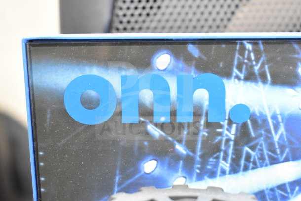 Store display featuring Onn Large Party Speaker, highlighted by blue logo and dynamic background, showing brand presence.