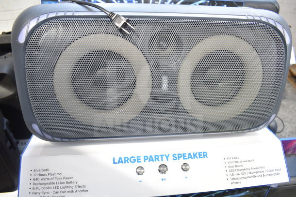 Onn Large Party Speaker with Bluetooth, 640W peak power, LED lighting, IPX4 water resistance, and FM radio, displayed in-store.