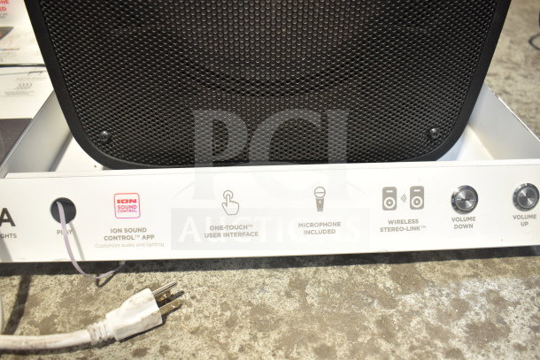 Ion Pro Glow Ultra Speaker with display stand, featuring one-touch interface, microphone, and wireless stereo-link.