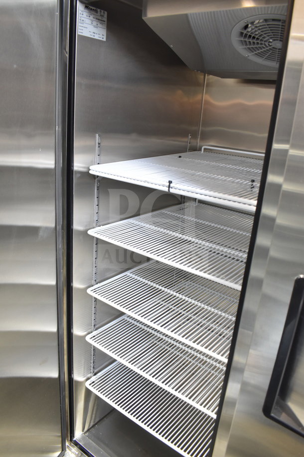 Brand new Migali LL-2R commercial cooler with two doors, stainless steel finish, shelving, scratch and dent condition.