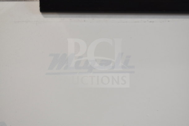 Brand new 2016 Migali C-12RG cooler with 2 doors. Scratch and dent condition. 115 volts, 1 phase. Logo visible.