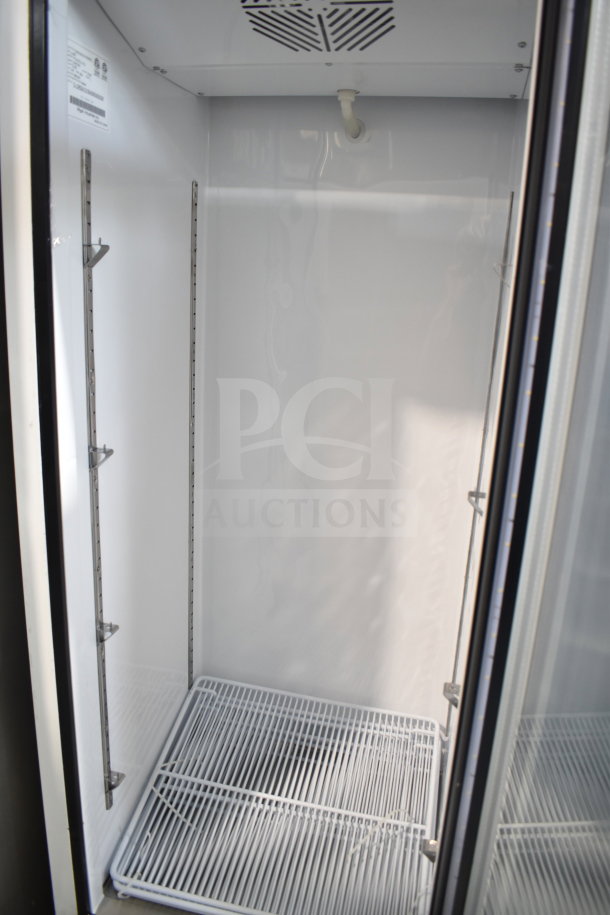 Brand new 2016 Migali C-12RG 2-door reach-in cooler merchandiser, 115V, 1 phase, interior shelves visible.