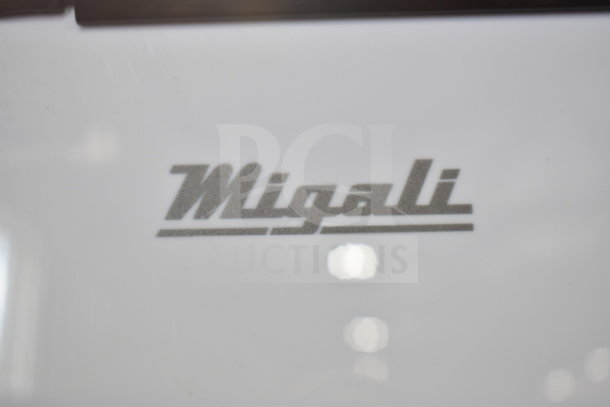 "2021 Migali C-49FM-HCe commercial freezer logo, gray text on white background."