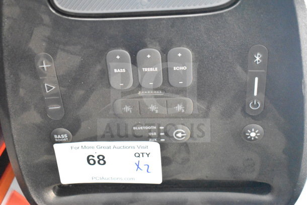 JBL Partybox 310 speaker control panel with bass, treble, echo buttons. Bluetooth, USB, AUX inputs. Store display tag visible.