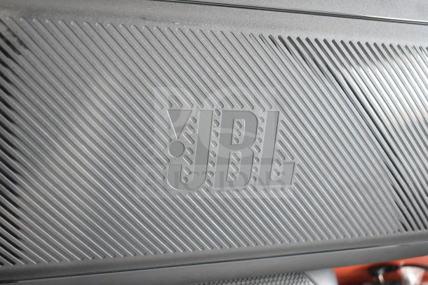 JBL Partybox 310 speaker on store display, showcasing the JBL logo. Sleek design, excellent condition, ideal for parties.