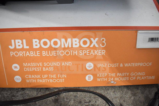 JBL Boombox 3 display sign highlighting its massive bass, IP67 waterproof rating, and 24-hour playtime.