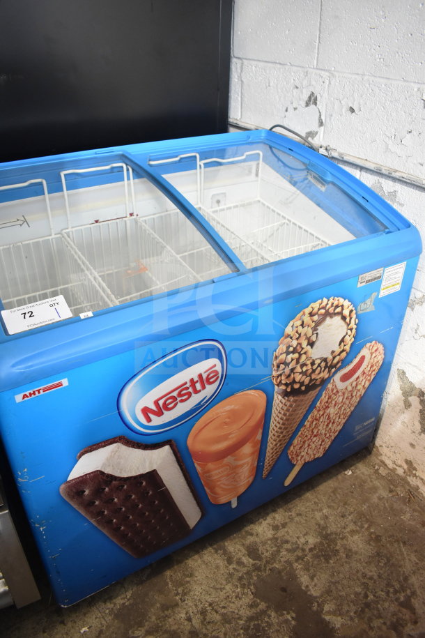 AHT Commercial Chest Freezer Merchandiser, 115 Volts, 1 Phase, blue casing with Nestlé branding, sliding glass lid.