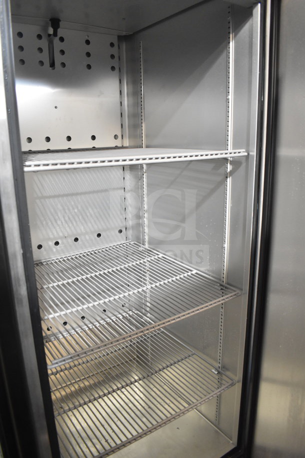 2019 True T-23F-HC single door freezer, stainless steel interior, three wire shelves, on commercial casters.