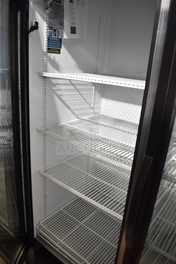 2019 True GDM-72-HC commercial 3-door cooler, with shelving, labels indicating 115 volts, 1 phase, tested and working.