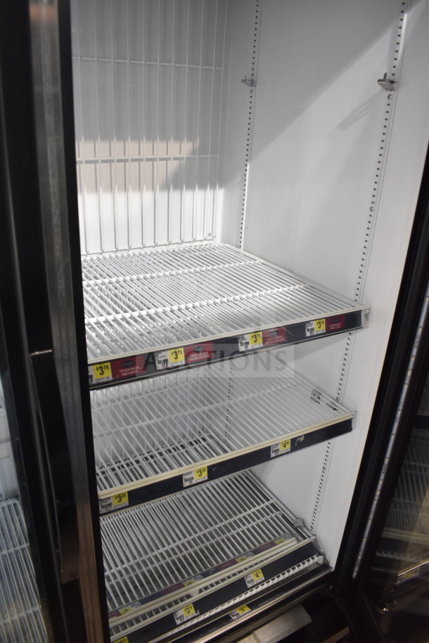 2018 True GDM-49F-HC commercial 2-door freezer merchandiser, tested and working, with multiple wire shelves.