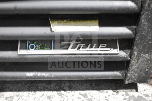 True logo and "natural refrigerant" label on the bottom vent of a True GDM-72-HC commercial cooler.