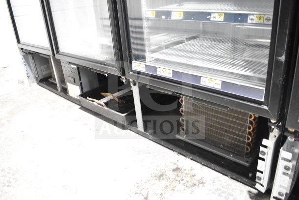 2018 True GDM-72F-HC commercial 3-door reach-in freezer, tested and working, 115/208-230 volts, 1 phase, shelves visible.