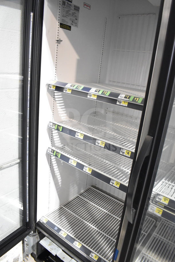 2018 True GDM-72F-HC 3-door freezer merchandiser, white interior, glass doors, shelves with price labels, tested and working.