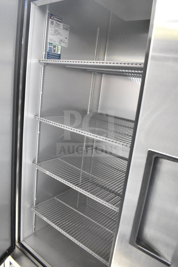 2020 True T-49-HC commercial reach-in cooler, stainless steel, 2-door, on casters, interior shelves, visible model label. 115V.