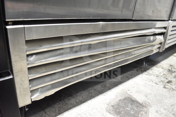 2020 True T-49F-HC freezer, dented bottom panel, stainless steel, 115V, on casters, commercial use.