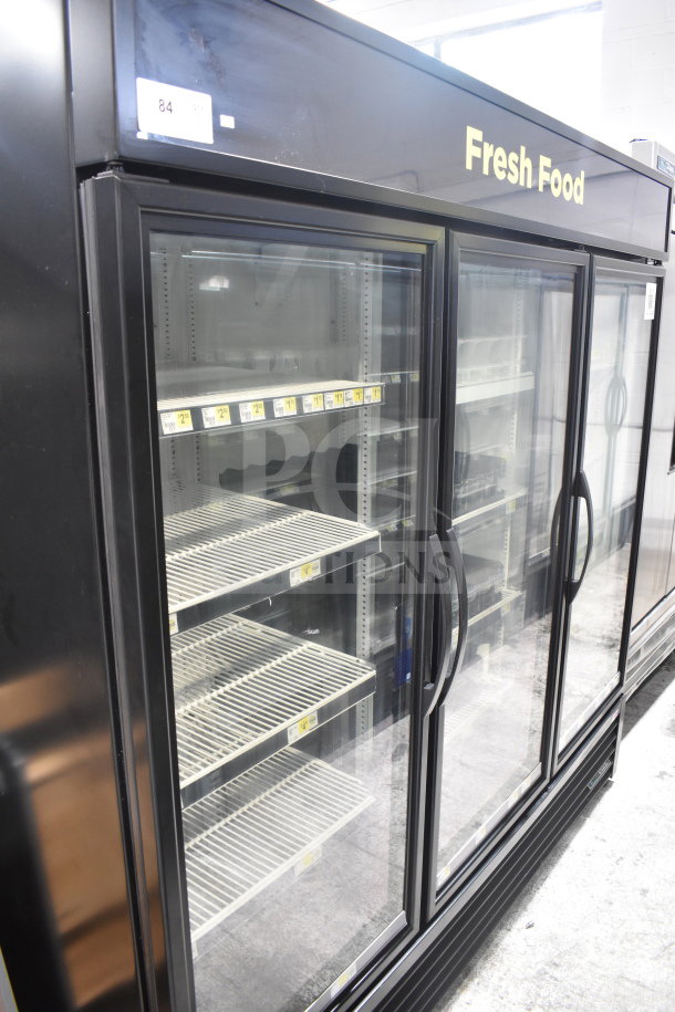 True GDM-72-HC commercial 3-door reach-in cooler, black, on casters. Visible "Fresh Food" label. 115V, 1 phase.
