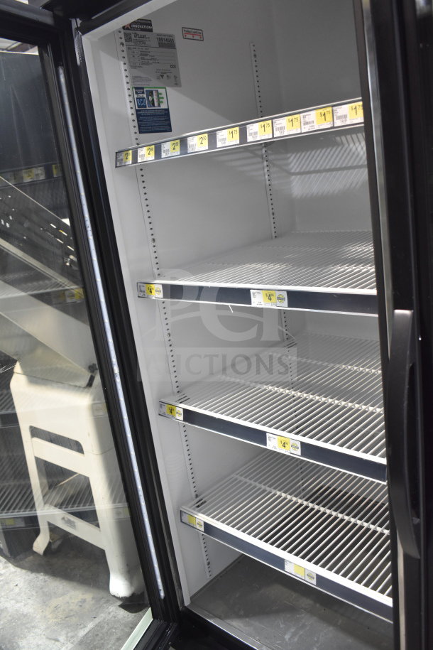 True GDM-72-HC 3 Door Reach In Cooler, commercial casters, 115V, 1 phase, interior shelving, energy-efficient.