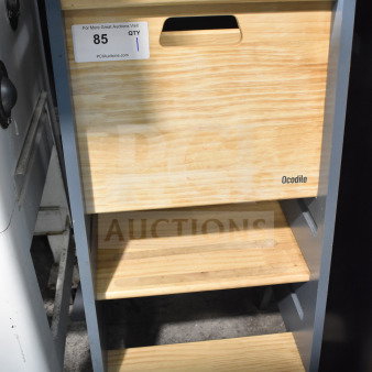 Ocodile Toddler Standing Tower in wood, three steps, sturdy condition, visible brand marking, auction tag attached.