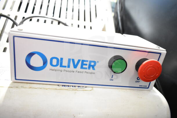 Oliver 797-32NC commercial bread slicer control panel, showing brand logo, power buttons, and "Helping People Feed People" slogan.
