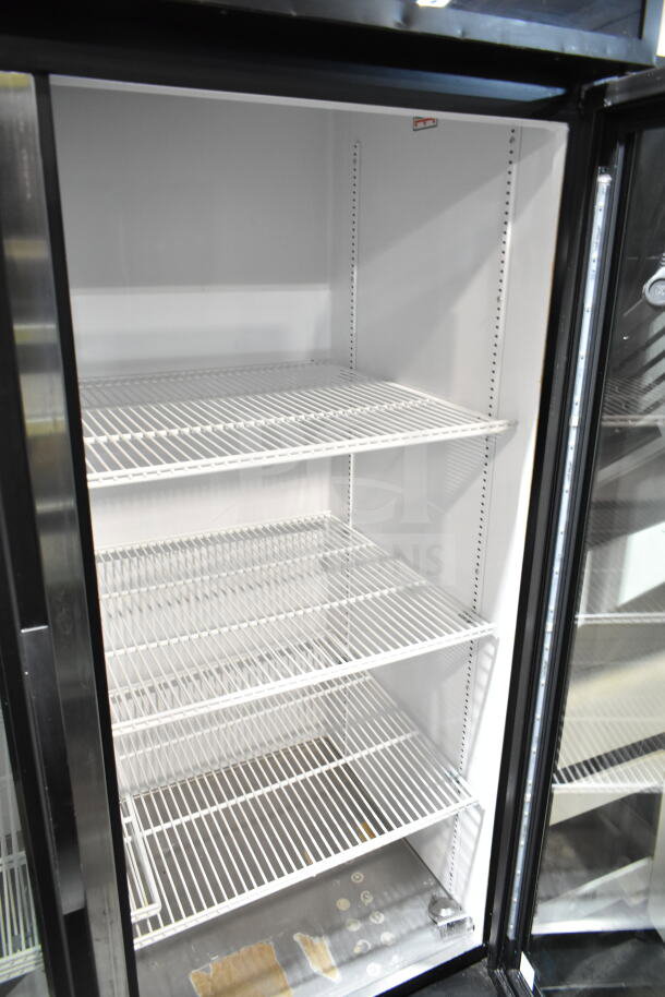 2019 True GDM-49-HC 2 Door Reach-In Cooler Merchandiser, white shelves, clean interior, 115 Volts, 1 Phase.