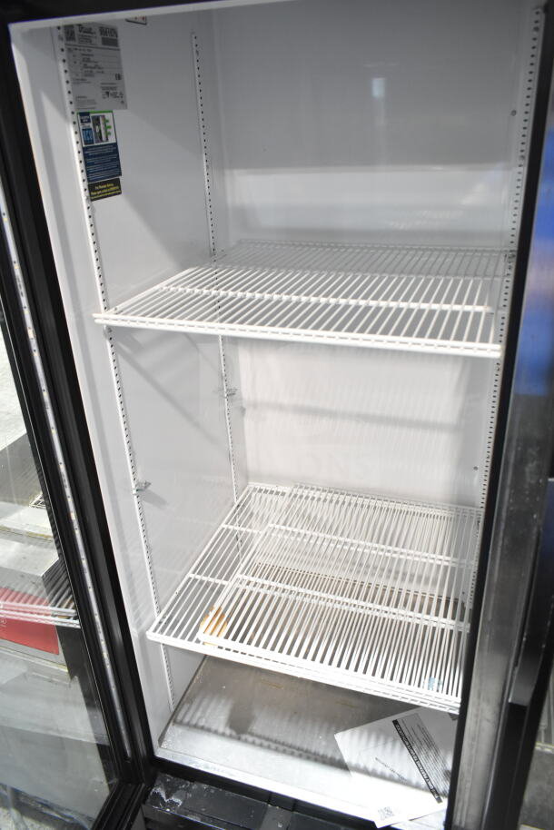2019 True GDM-49-HC commercial 2 door reach-in cooler merchandiser, clean interior, visible labels, 115 volts, 1 phase.