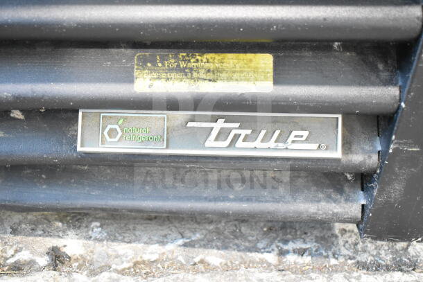 2019 True GDM-49-HC cooler with logo and natural refrigerant label, showing some dirt, 115V, 1 Phase.