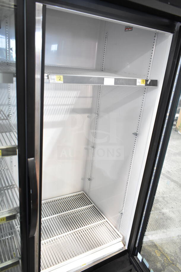 2019 True GDM-49-HC reach-in cooler, 2 glass doors, excellent condition, 115V, 1 phase, spacious shelving for merchandise.