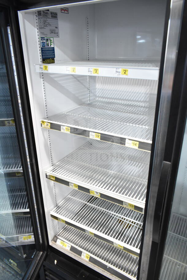 2019 True GDM-49-HC commercial cooler, 2 glass doors, adjustable shelves, shows tags with shelving prices, 115V, 1 phase.