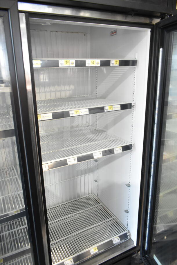 True GDM-72F-HC commercial 3-door reach-in freezer with glass doors, shelves, and interior lighting. Model year 2016.