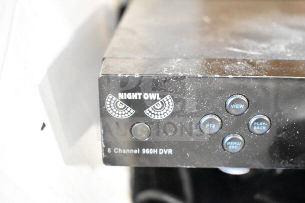 Night Owl 8 Channel 960H DVR, front panel with logo and function buttons visible. Dust present on surface.