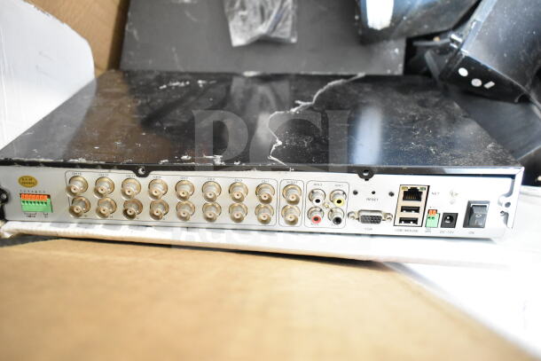 Back panel of a digital video recorder with multiple BNC inputs, RCA audio jacks, Ethernet, VGA, USB ports, power switch.