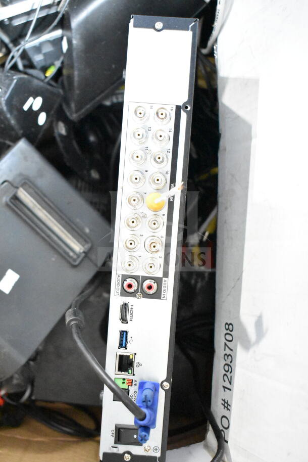 Back panel of a digital video recorder showing multiple input/output ports including HDMI, USB, audio, and BNC connectors.