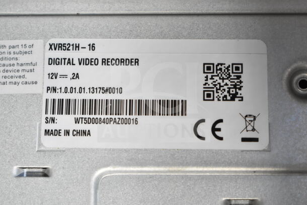 Digital Video Recorder label showing model XVR521H-16, 12V power requirements, barcode, serial number, and "Made in China."