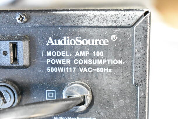 AudioSource AMP100 amplifier, model details visible, 500W/117VAC power consumption. Includes various electronics.