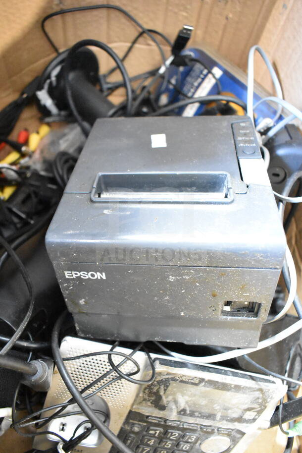 Various electronic items including Epson receipt printer and cables, showing signs of wear. Auction lot of 15 items.