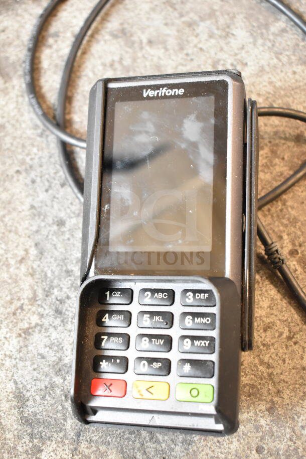 Verifone credit card reader with display and keypad, part of a 15-item auction lot. Appears in used condition.