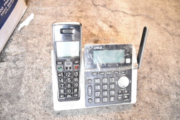 AT&T cordless phone set with digital display and keypad, includes a base station with Caller ID feature, in used condition.