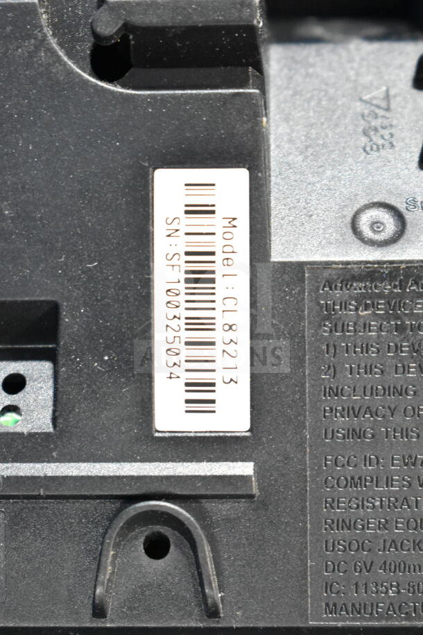 Barcode label on electronic device showing Model: CL83213, SN: SF100325034. Text includes FCC ID and specifications.