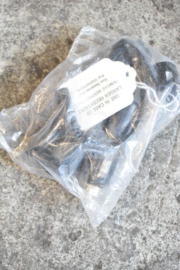 Plastic bag containing assorted small electronic components, labeled with cautionary instructions.