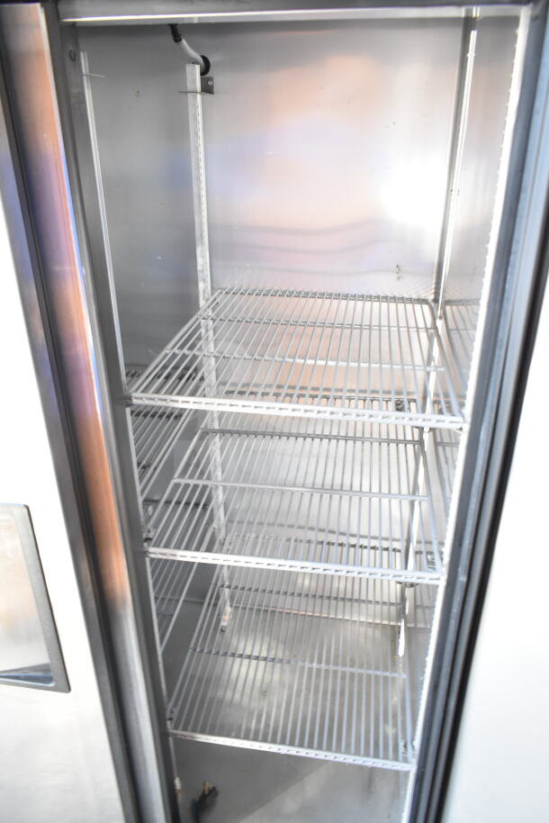 2017 True T-35-HC commercial 2-door reach-in cooler, stainless steel interior, three shelves, 115 volts, excellent condition.