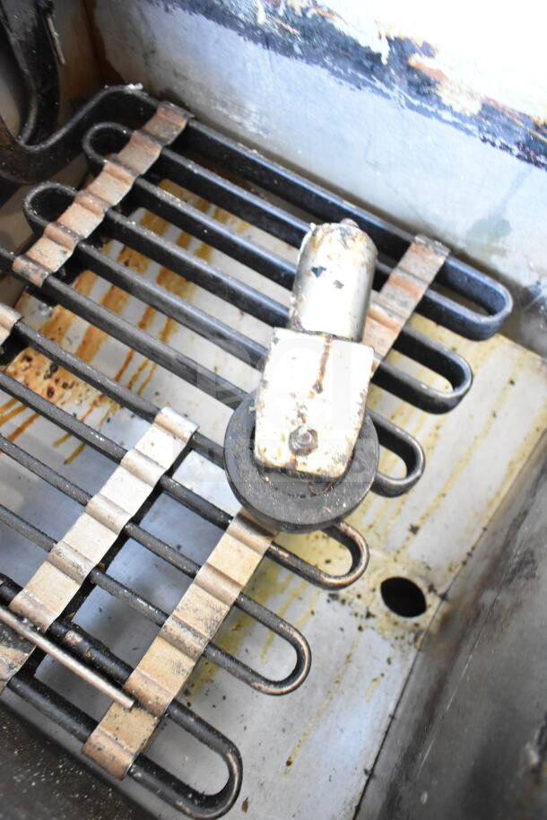 Vulcan 1ERD50 commercial electric deep fat fryer caster with visible wear and grease buildup. 480 volts, 3 phase.