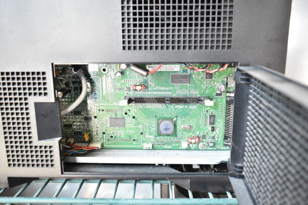 Dell 2350dn printer internal circuit board, showcasing components and wiring, in open access panel.
