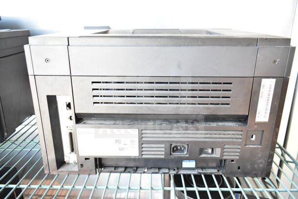 Dell 2350dn countertop printer, good condition, rear view showing ports and FCC compliance label.