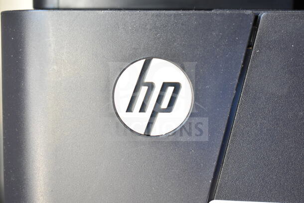 HP LaserJet Pro MFO M127fn printer, black, with HP logo. Compact design suitable for countertops, excellent condition.