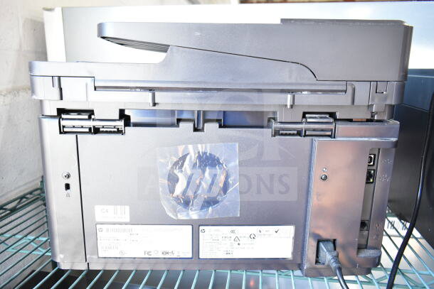 HP LaserJet Pro MFP M127fn countertop printer, showing rear ports and labels, good condition, minor scratches.